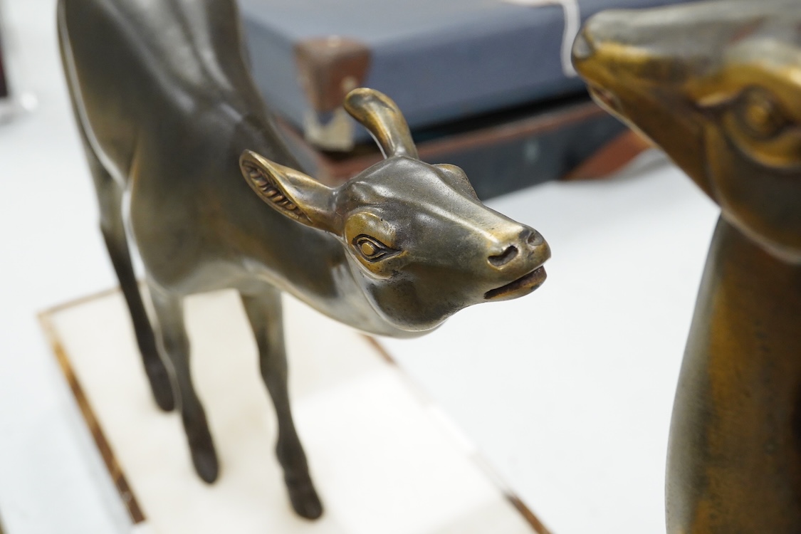 An Art Deco spelter and marble stag and deer group, 70cm wide